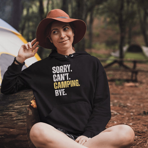 Introducing the ultimate escape gear for all the weekend warriors, the "Sorry. Can't. Camping. Bye." hoodie! This isn't just any ordinary piece of clothing; it's your ticket to avoiding all unwanted plans, chores, and responsibilities.